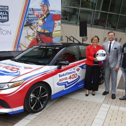Charlotte Mayor Vi Lyles, Speedway Motorsports CEO Marcus Smith, NASCAR driver Erik Jones and Charlotte Motor Speedway Executive Vice President Greg Walter pose at the Laps around Uptown event on Tuesday in Uptown Charlotte.