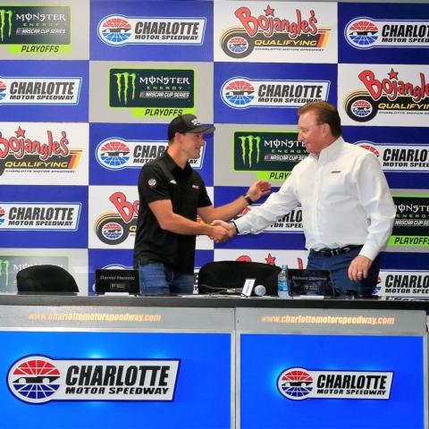 NASCAR driver Daniel Hemric, left, shakes hands with car owner Richard Childress prior to a Friday announcement at Charlotte Motor Speedway. Hemric will drive Childress' No. 31 Chevrolet in the 2019 Monster Energy NASCAR Cup Series season.