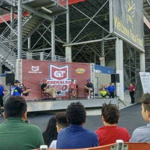 Students look on during a Q&A session with NASCAR driver Kyle Larson at Charlotte Motor Speedway's STEM Expo.