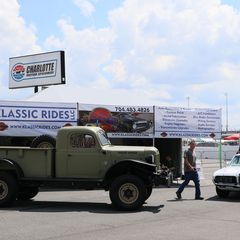 The Klassic Rides display near the exit of pit road showcases a wide array of vintage automobiles during the opening day of the Pennzoil AutoFair presented by Advance Auto Parts.