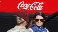 Danica Patrick shakes hands with a member of the military during pre-race festivities before Sunday's running of the Coca-Cola 600 at Charlotte Motor Speedway.