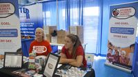 Speedway Children's Charities volunteers set up during opening day of the Charlotte AutoFair at Charlotte Motor Speedway.