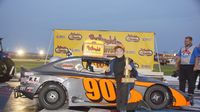 Daniel Wilk poses for a photo after his sixth consecutive Bandolero Bandit win Tuesday during Round 6 of the Bojangles' Summer Shootout at Charlotte Motor Speedway.