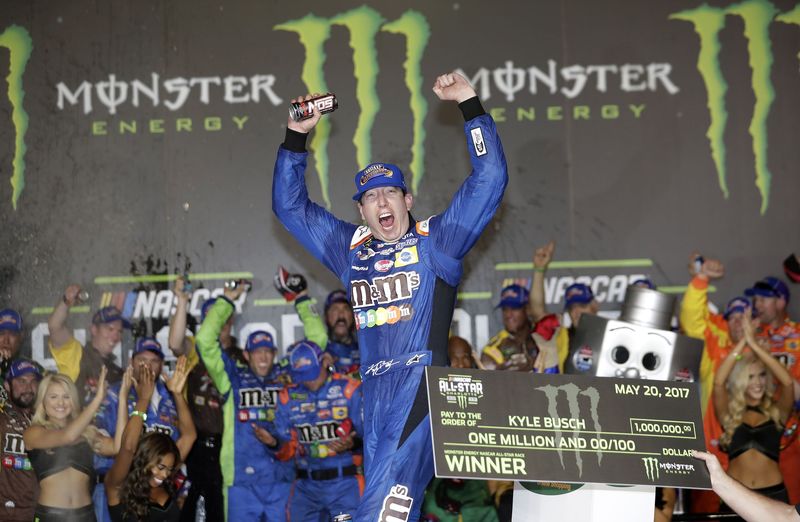 Kyle Busch celebrates winning Saturday's Monster Energy All-Star Race at Charlotte Motor Speedway.