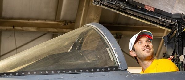 Coca-Cola Racing Family driver Daniel Suárez sits in the cockpit of an F15 Strike Eagle fighter jet during his Mission 600 visit to Seymour Johnson Air Force Base. 