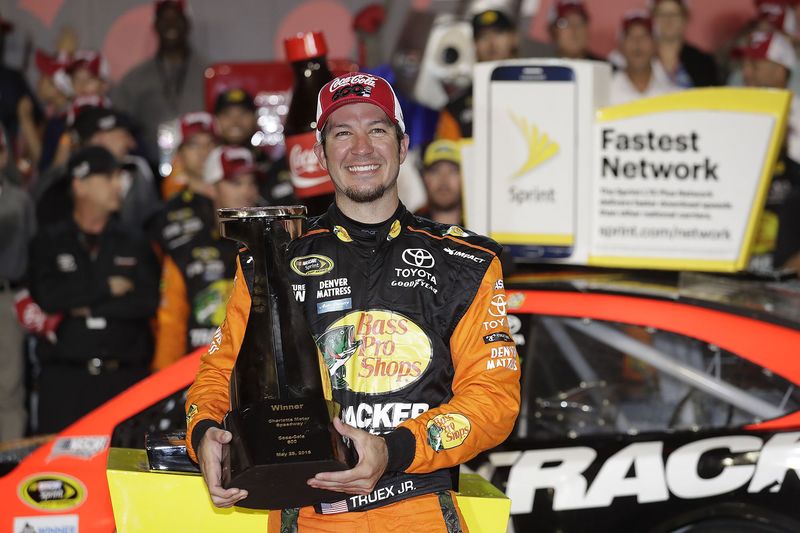 Martin Truex Jr. celebrates after winning Sunday's Coca-Cola 600 at Charlotte Motor Speedway in a record-breaking performance. 