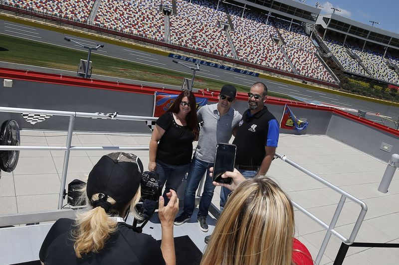 FOX Sports analyst Jeff Gordon meets with fans during a Mega Pass Memories event on Tuesday at Charlotte Motor Speedway.
