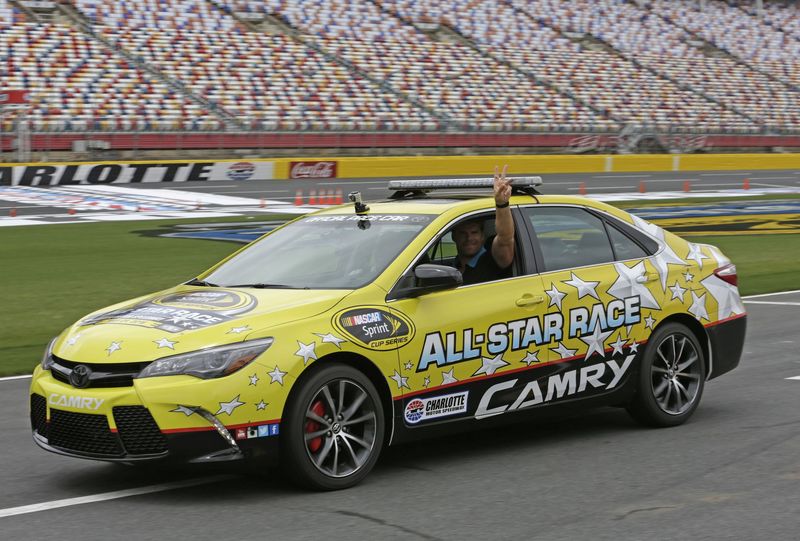 Carolina Panthers tight end Greg Olsen waves as he drives the Toyota pace car on Wednesday at Charlotte Motor Speedway. Olsen will pace the field prior to Saturday's NASCAR Sprint All-Star Race.
