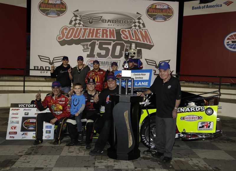 Ryan Preece, seated third from left on the front row, celebrates with his team after winning Thursday's Bad Boy Off Road Southern Slam 150 NASCAR Whelen Modified Series race at Charlotte Motor Speedway