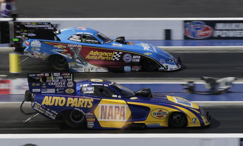 Sixteen-time NHRA Funny Car champion John Force and 2016 champion Ron Capps battle during last season's NHRA Carolina Nationals at zMAX Dragway.