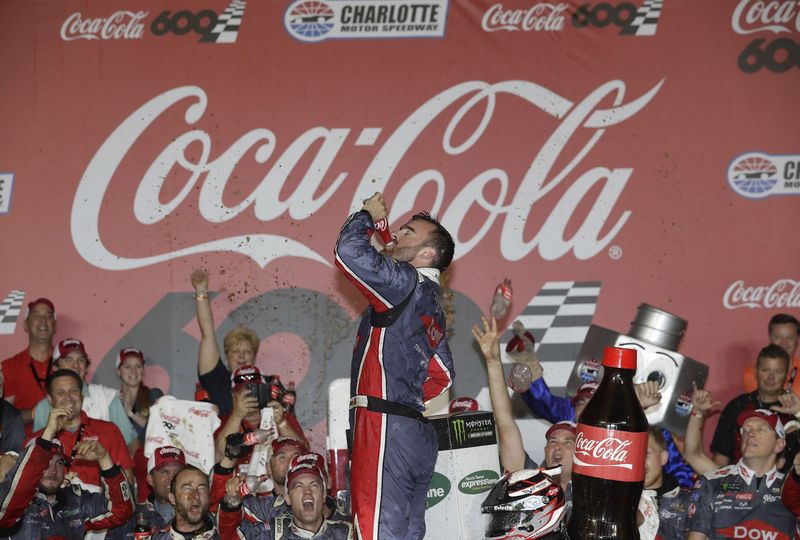 Austin Dillon celebrates in Charlotte Motor Speedway's winner's circle early Monday morning after winning the Coca-Cola 600.