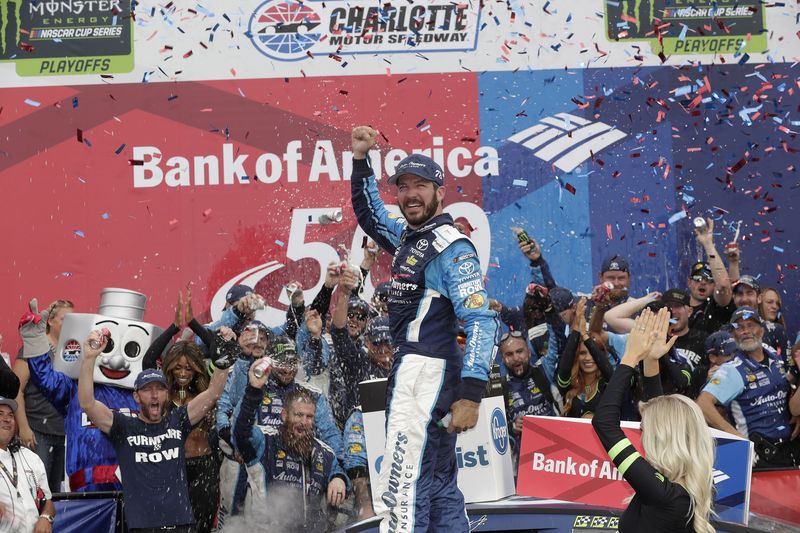 Martin Truex Jr. celebrates after winning Sunday's Bank of America 500 at Charlotte Motor Speedway. Truex led 91 of 337 laps on his way to his second win at Charlotte.