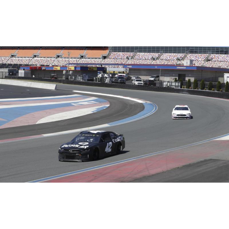 Kyle Larson (42) leads Trevor Bayne during a Goodyear tire test on Tuesday on the Charlotte Motor Speedway ROVAL™.