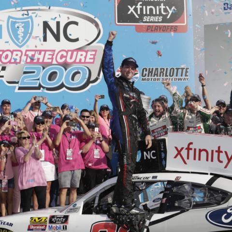 Chase Briscoe celebrates after winning Saturday’s Drive for the Cure 200 presented by Blue Cross Blue Shield of North Carolina on the Charlotte Motor Speedway ROVAL™.