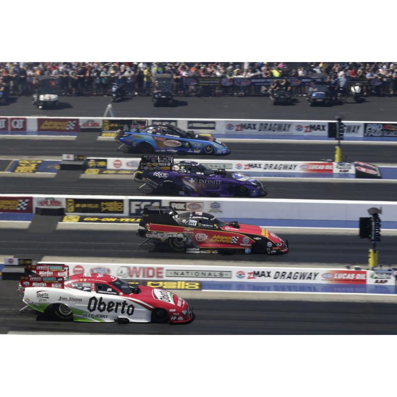 Courtney Force, second from front, edged ahead of the pack in Funny Car qualifying for the NGK Spark Plugs NHRA Four-Wide Nationals at zMAX Dragway.