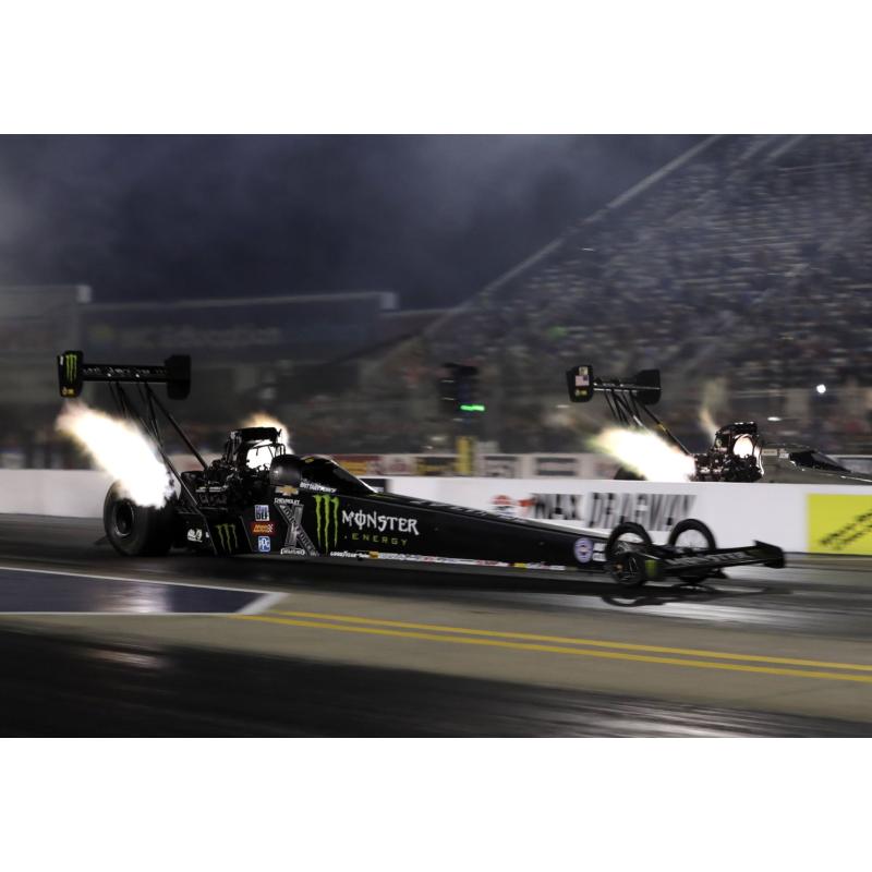Brittany Force set a zMAX Dragway Top Fuel record for lowest elapsed time with a 3.689-second pass at 318.39 mph during Friday's qualifying for the NGK Spark Plugs NHRA Four-Wide Nationals.