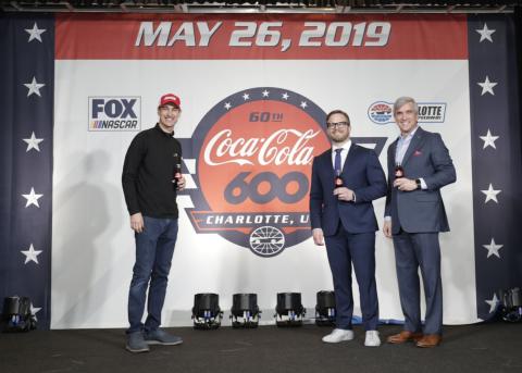 Coca-Cola Racing Family driver and defending NASCAR Cup Series champion Joey Logano, left, joins Speedway Motorsports, Inc. President and CEO Marcus Smith, center, and Charlotte Motor Speedway Executive Vice President and General Manager Greg Walter at a Coca-Cola 600 logo unveil on Monday at Charlotte Motor Speedway.