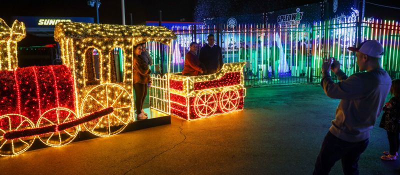 The Speedway Christmas presented by Atrium Health Walking Trail dazzles guests with its life-sized candy land filled with candy canes, a gingerbread house and more.