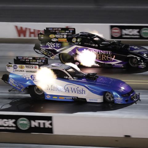 Jack Beckman, top, set a Funny Car track-record 334.07 mile-per-hour pass in 3.873 seconds during NTK NHRA Carolina Nationals qualifying on Friday at zMAX Dragway.