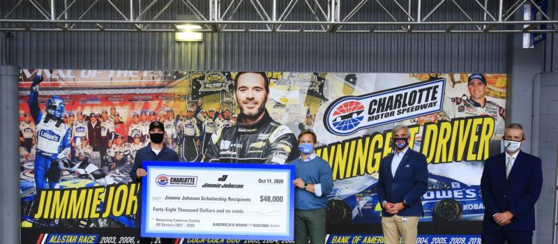 Seven-time Cup Series champion Jimmie Johnson was honored with a giant mural recognizing his historic success at Charlotte Motor Speedway as well as the establishments of a $48,000 scholarship fund in his name during a special presentation Sunday, before his final race at America's Home for Racing. Making the presentation were Marcus Smith, CEO of Speedway Motorsports; Greg Walter, executive vice president and general manager of Charlotte Motor Speedway and Dr. Chris Lowder, superintendent of Cabarrus County Schools.