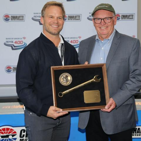 Speedway Motorsports President and CEO Marcus Smith presents the Smokey Yunick Award to legendary NASCAR crew chief Gary Nelson prior to Sunday's Bank of America ROVAL™ 400.