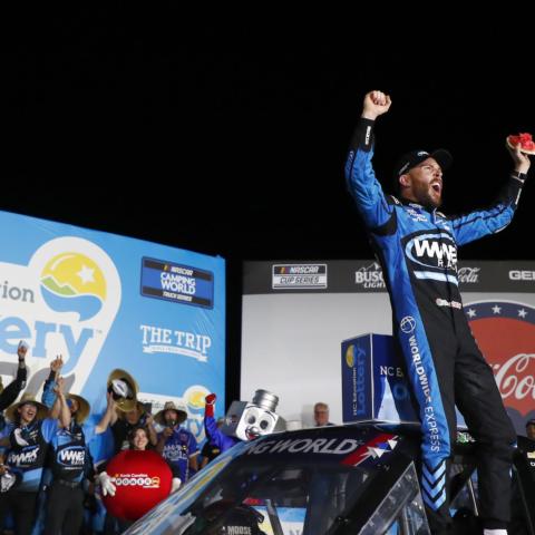 Ross Chastain celebrates after winning Friday's North Carolina Education Lottery 200 NASCAR Camping World Truck Series race at Charlotte Motor Speedway.