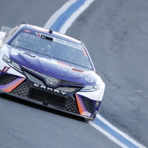 Denny Hamlin edged Kurt Busch to the pole for the Coca-Cola 600 by 0.003 seconds on Saturday at Charlotte Motor Speedway.