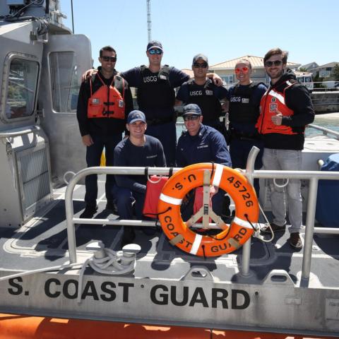 Coca-Cola Racing Family driver Daniel Suarez, top right, visited U.S. Coast Guard Station Wrightsville Beach Tuesday on a Mission 600 tour alongside Travis Mack (top left), his Trackhouse Racing crew chief. 