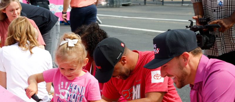 NASCAR drivers Daniel Hemric and Bubba Wallace joined Charlotte Motor Speedway's Paint Pit Wall Pink event, trading their driving gloves for paint brushes to prep for the upcoming NASCAR weekend at America's Home for Racing.