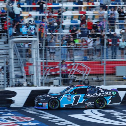 Sam Mayer celebrates after winning Saturday's Drive for the Cure 250 presented by Blue Cross Blue Shield of North Carolina at the Charlotte Motor Speedway ROVAL™. 