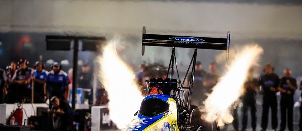Brittany Force powers her 11,000-horsepower Top Fuel dragster off the starting line during last year's Night of Fire event at zMAX Dragway. 