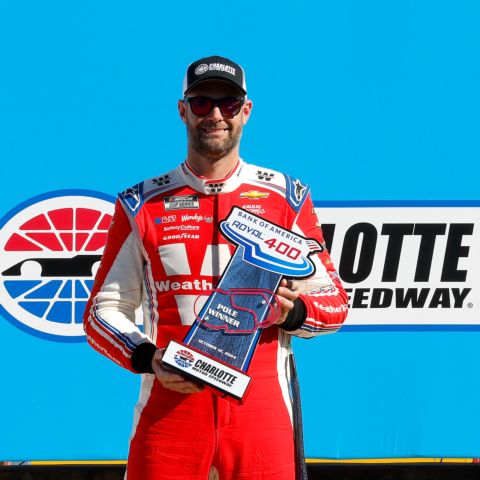 Shane Van Gisbergen holds his pole winner trophy after claiming the pole for Sunday's Bank of America ROVAL™ 400. 