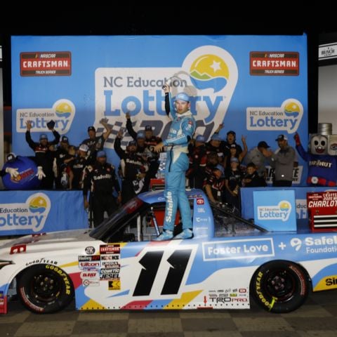 Corey Heim celebrates after winning Friday's NASCAR CRAFTSMAN Truck Series NC Education Lottery 200 at Charlotte Motor Speedway.