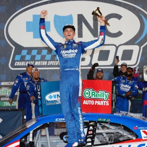 Corey Day celebrates after winning Sunday's Blue Cross NC 300 NASCAR O'Reilly Auto Parts Series race at Charlotte Motor Speedway.