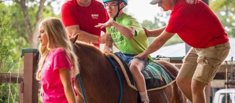 Speedway Motorsports volunteers worked alongside riders at Wings of Eagles Ranch, lending a hand during therapeutic horseback riding sessions. 