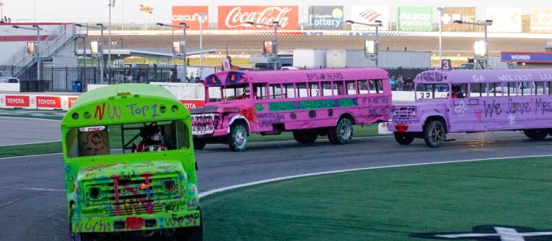 Northwest Cabarrus Middle School Principal Chasity Szabo pedals to the finish line to claim the victory of Charlotte Motor Speedway’s Cook Out Summer Shootout Bus Race