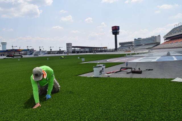 Turf installation continued on Tuesday at Charlotte Motor Speedway.