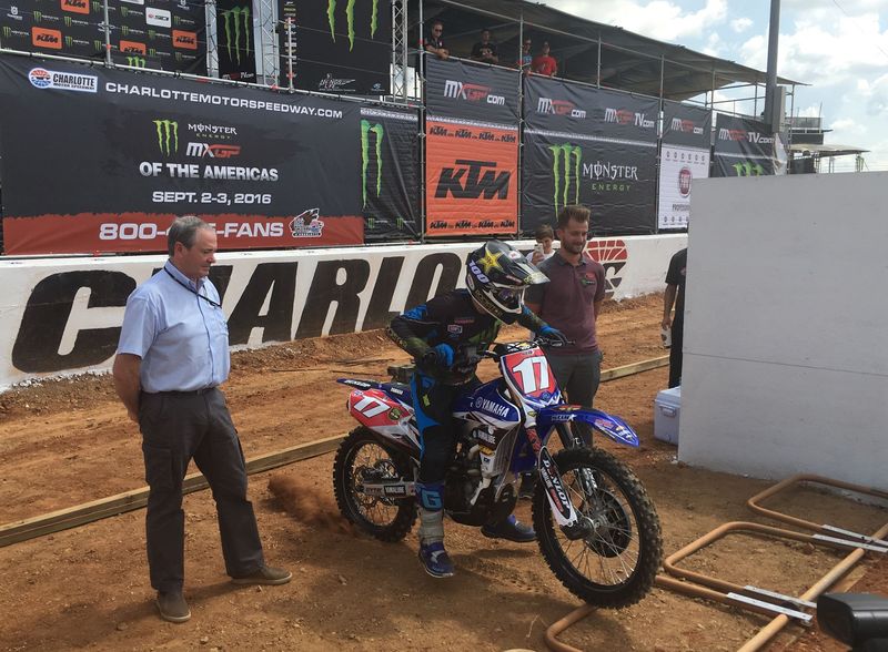 Yamaha rider and Morehead City, North Carolina, native Cooper Webb takes off during a ceremonial gate drop at the Monster Energy MXGP of the Americas at The Dirt Track at Charlotte on Thursday, as FIM Motocross Commission Director Tony Skillington, left, observes. 