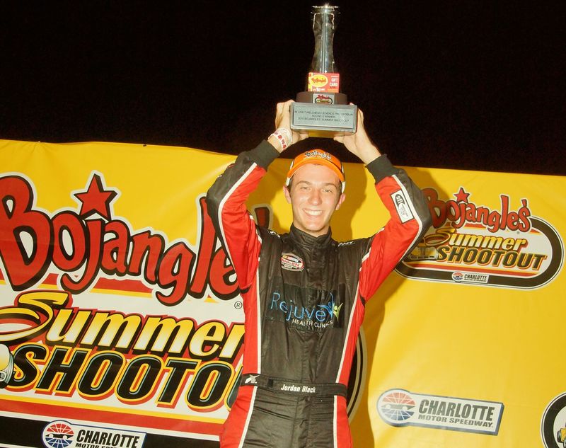 Jordan Black celebrates after winning the In Light Wellness Legend Car Pro feature during Bojangles' Summer Shootout on Tuesday at Charlotte Motor Speedway. 