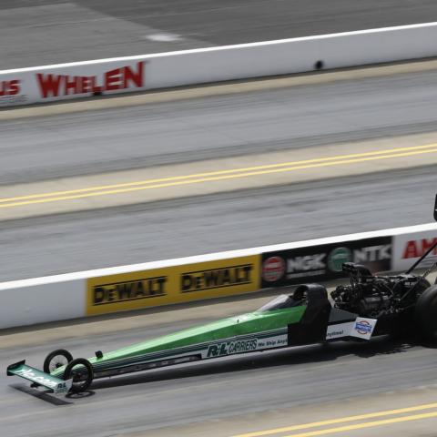 Part-time NHRA Top Fuel driver Josh Hart knocked off No. 1 qualifier Brittany Force to win the Top Fuel portion of Sunday's DEWALT NHRA Carolina Nationals at zMAX Dragway.