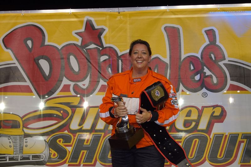 Mount Tabor United Methodist Church pastor Kris Mares celebrates after winning Tuesday's Fastor Pastor school bus race during the Bojangles' Summer Shootout's seventh race night at Charlotte Motor Speedway, presented by North Carolina Virtual Academy.