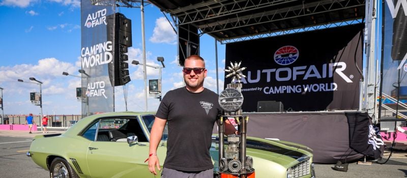 Donnie Freeman stands proudly with his 1969 Chevy Camaro Z/28 after winning the prestigious Walt Holified Best of Show Award during the final day of AutoFair presented by Camping World at Charlotte Motor Speedway.
