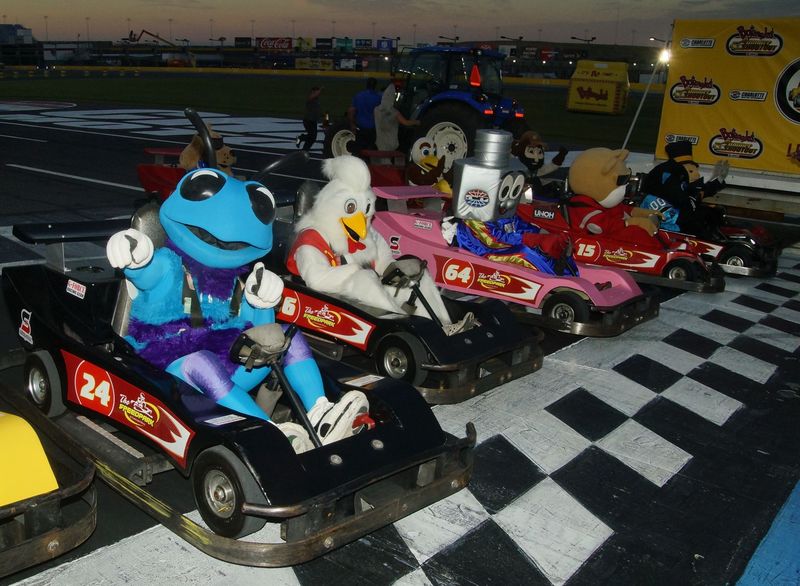 Area sports mascots including Hugo the Hornet and Lug Nut will battle in go-karts during the Mascot Mania portion of Tuesday's Bojangles' Summer Shootout at Charlotte Motor Speedway.