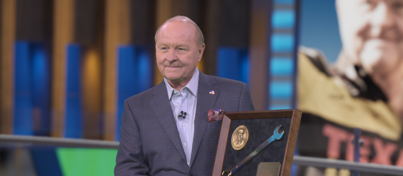 Speedway Motorsports President and CEO Marcus Smith (right) presented legendary crew chief and broadcaster Larry McReynolds with the Smokey Yunick Award during a taping of FOX Sports' 'Race Hub' on Monday. 