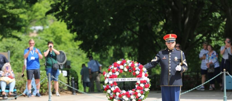 A member of the Old Guard stands near a wreath presented by Charlotte Motor Speedway and defending Coca-Cola 600 winner Christopher Bell as part of Mission 600, a prelude to the military salute to the U.S. Armed Forces ahead of the Coca-Cola 600 on Memorial Day weekend.