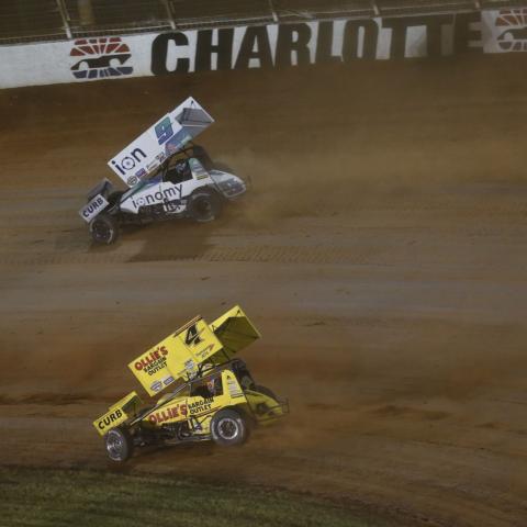 Daryn Pittman (9) battles teammate and car owner Kasey Kahne at The Dirt Track at Charlotte in May.