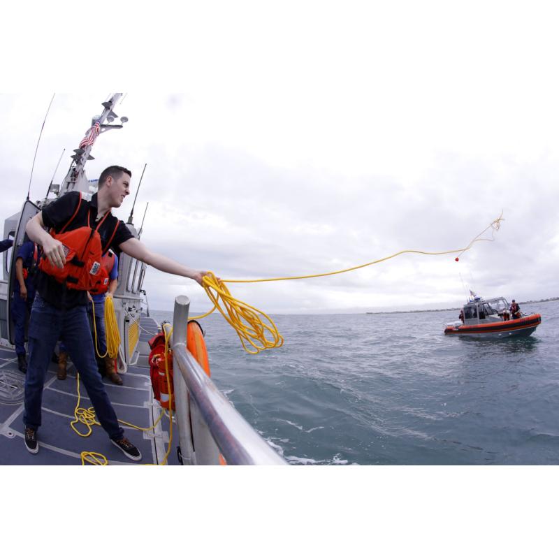 Alex Bowman, driver of the No. 88 Nationwide Chevrolet, tosses a heaving line to a mock stranded boat during a search-and-rescue training session with the U.S. Coast Guard Station Wrightsville Beach on Thursday. The visit was part of Mission 600, a series of interactive, educational visits for some of NASCAR’s top drivers to regional military bases. The event is a prelude to the largest Memorial Day weekend celebration in the country at the May 27 Coca-Cola 600 at Charlotte Motor Speedway.