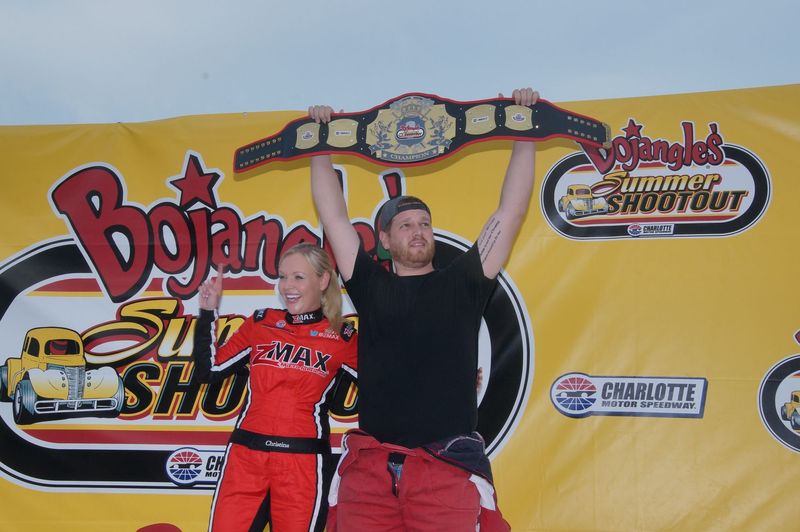 Hope City Church's Samuel Donahue celebrates after winning Tuesday's Faster Pastor school bus race during the Bojangles' Summer Shootout at Charlotte Motor Speedway. 