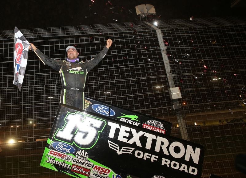 Donny Schatz celebrates his 20th World of Outlaws Craftsman Sprint Car Series win of the season during Friday's Textron Off Road World of Outlaws World Finals at The Dirt Track at Charlotte.