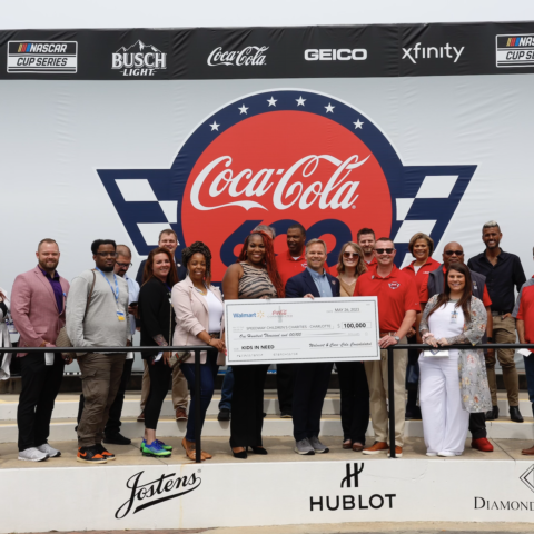 Walmart and Coca-Cola Consolidated presented a $100,000 check to Speedway Children’s Charities' Charlotte chapter on Friday.